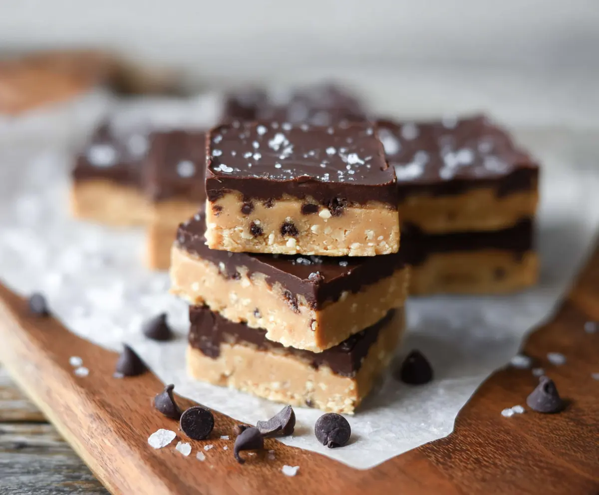 Delicious healthy no bake cookie dough bars on a white plate, showcasing a nutritious and easy snack option.