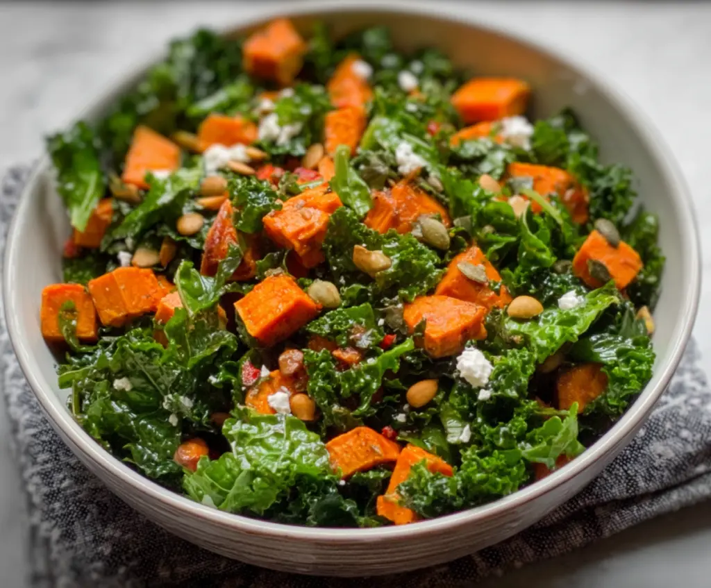 Fresh kale and roasted sweet potato salad served with vibrant vegetables and a light vinaigrette.