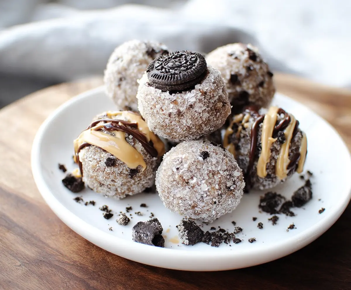 Delicious Nutritious Oreo Protein Balls on a white plate, perfect for healthy snacking.