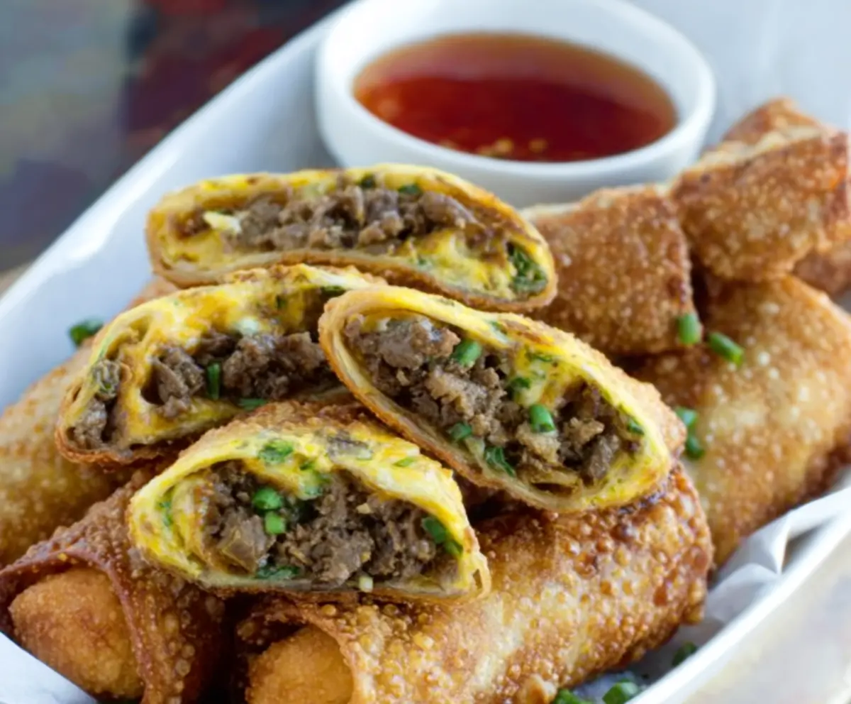 Delicious Philly Cheesesteak Egg Rolls filled with tender beef, melted cheese, and crispy wrapper, perfect for snack or appetizer.